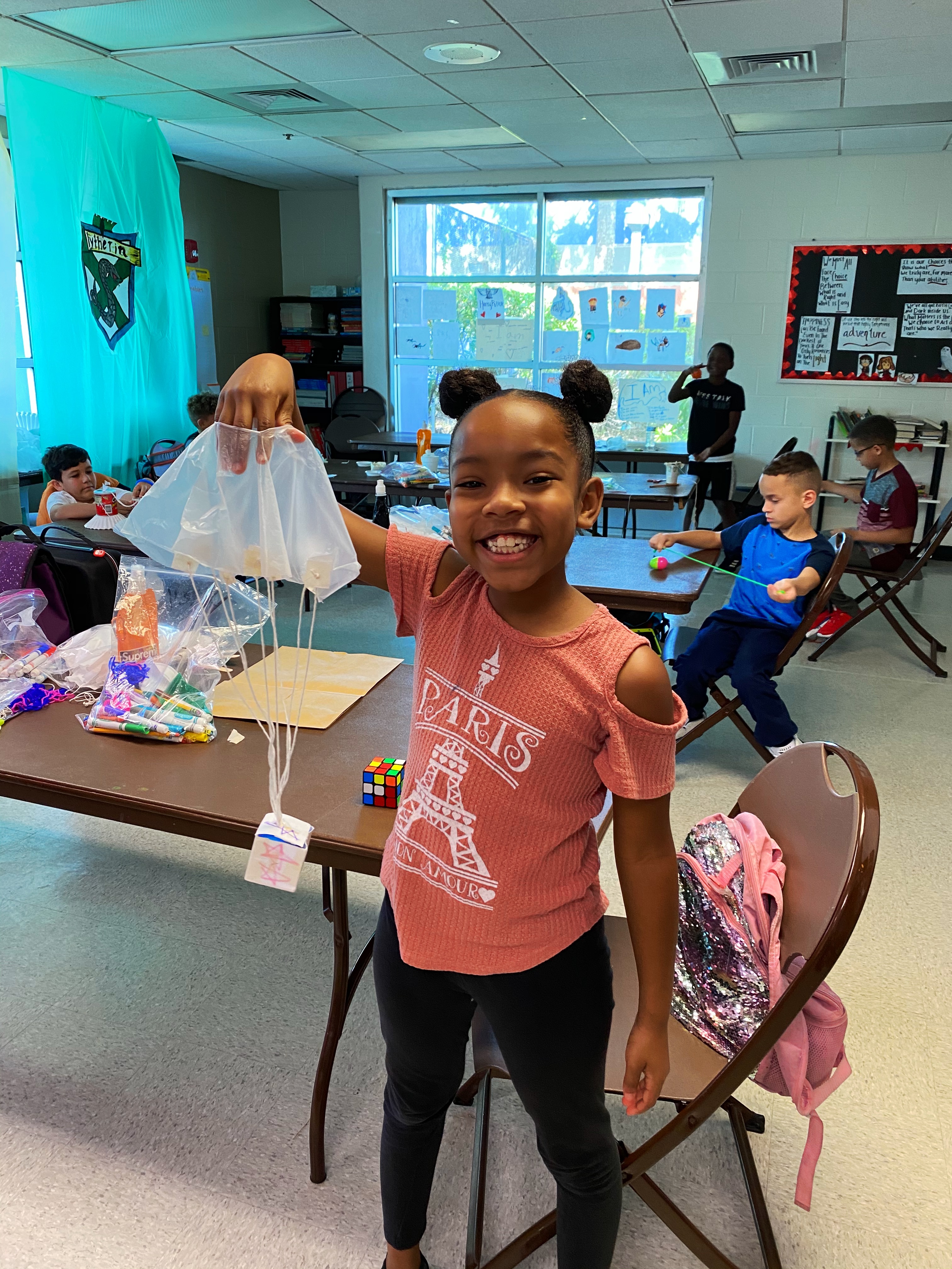 A student showing her science project.