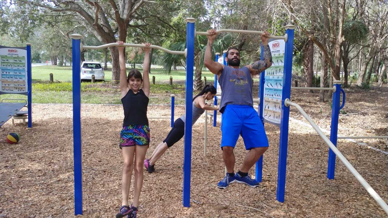 Residents exercising at the fitness stations