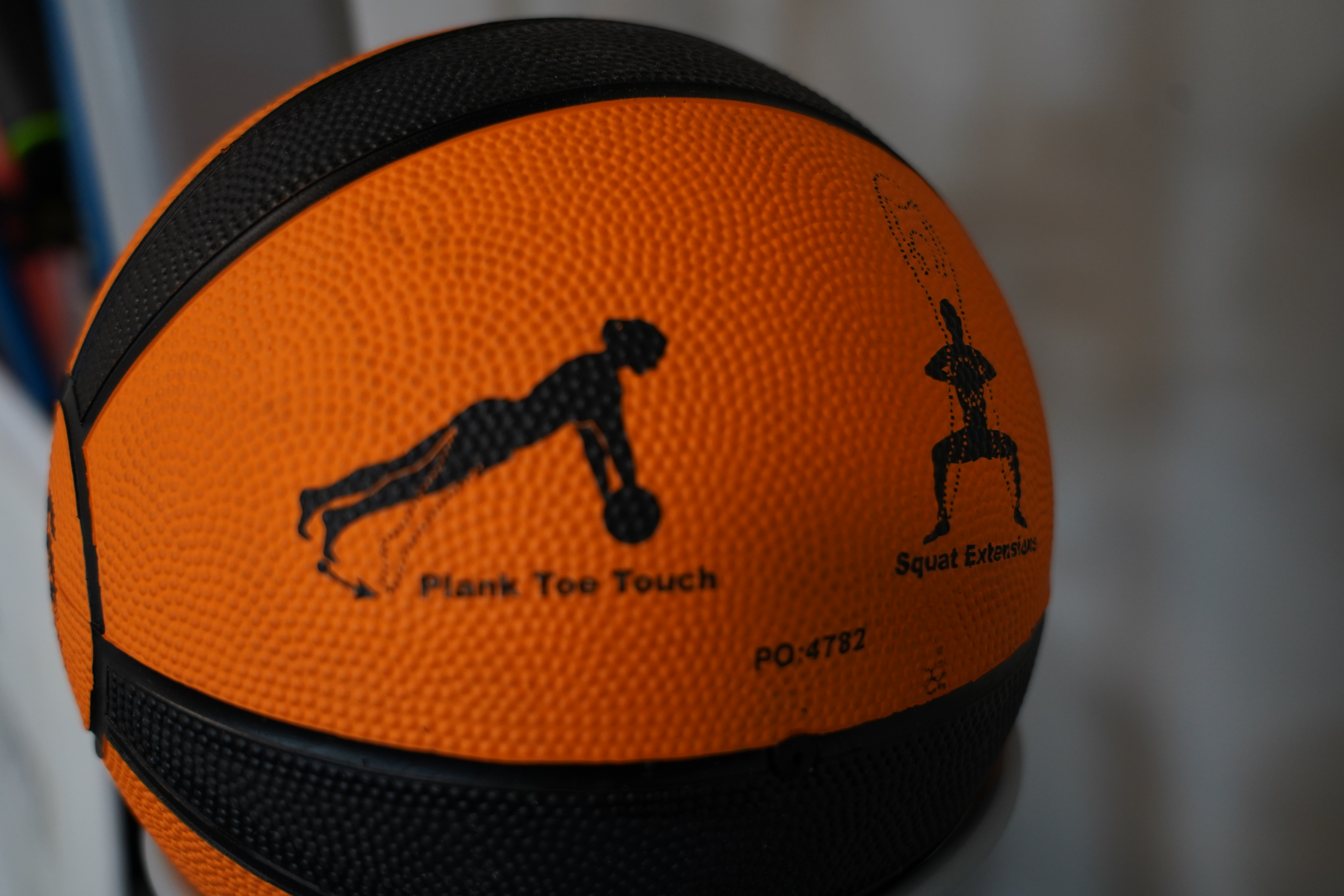 Exercise ball with images depicting workouts