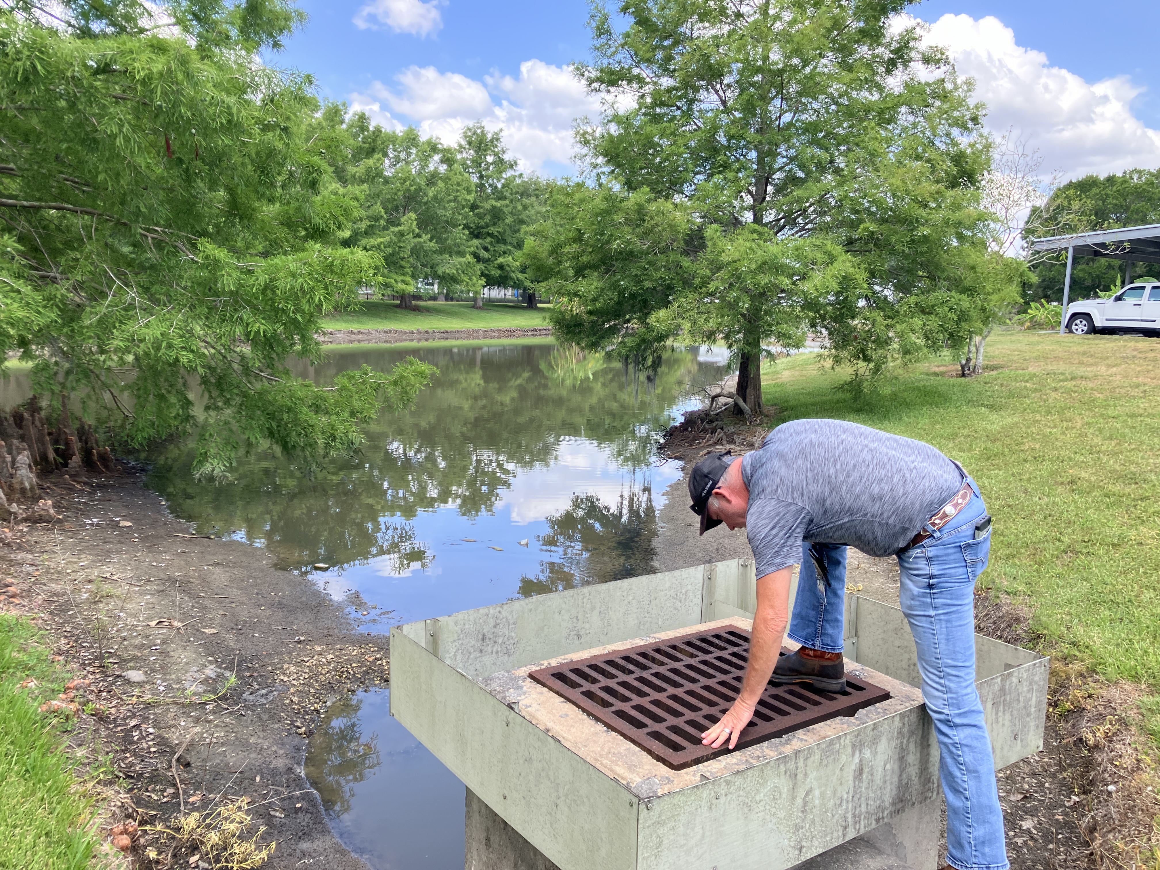 Man inspecting pond