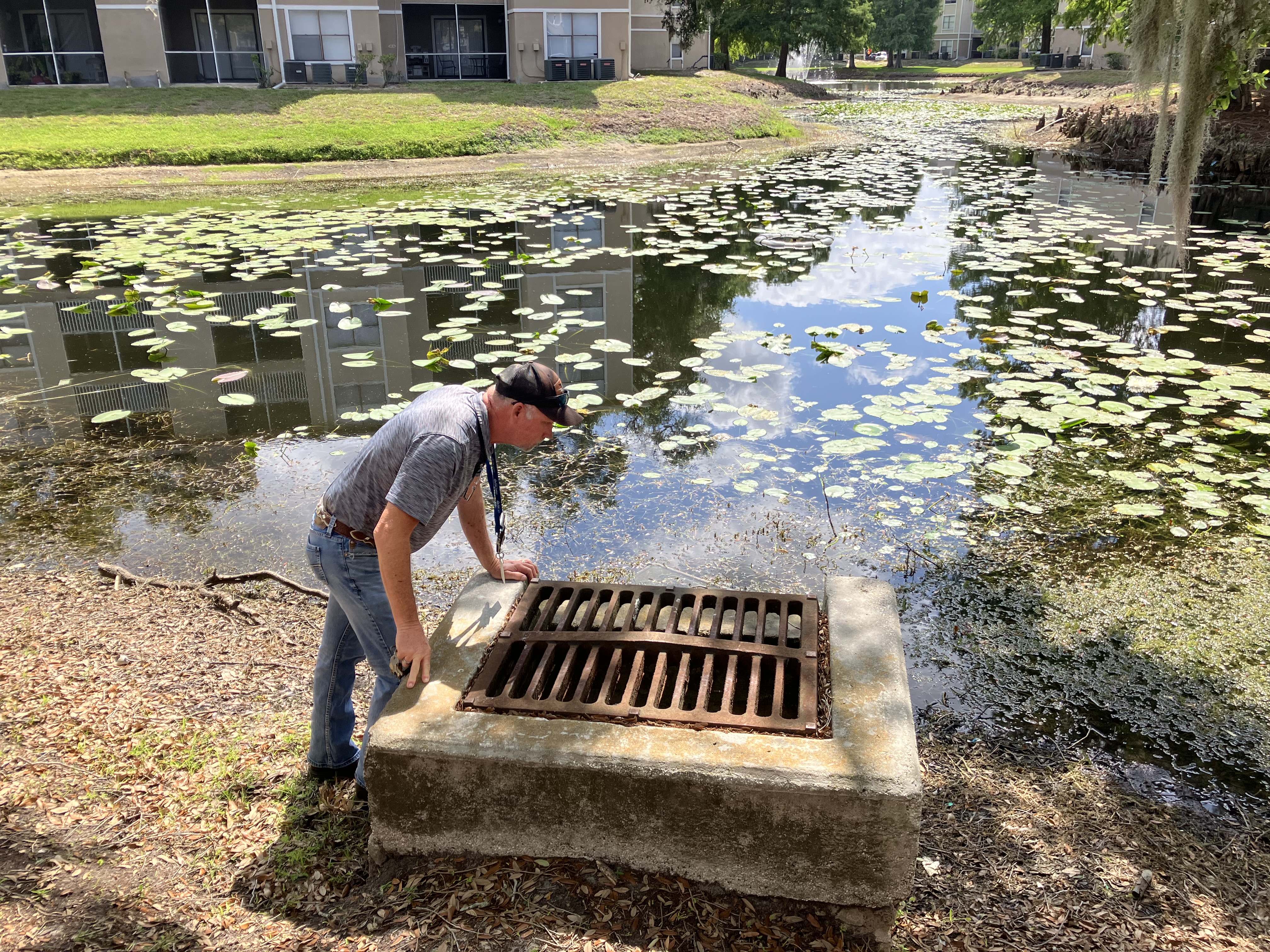 Man inspecting pond