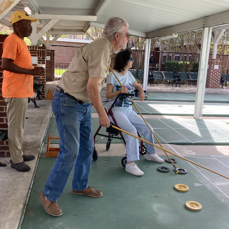 People shuffleboarding at Beardall Senior Center