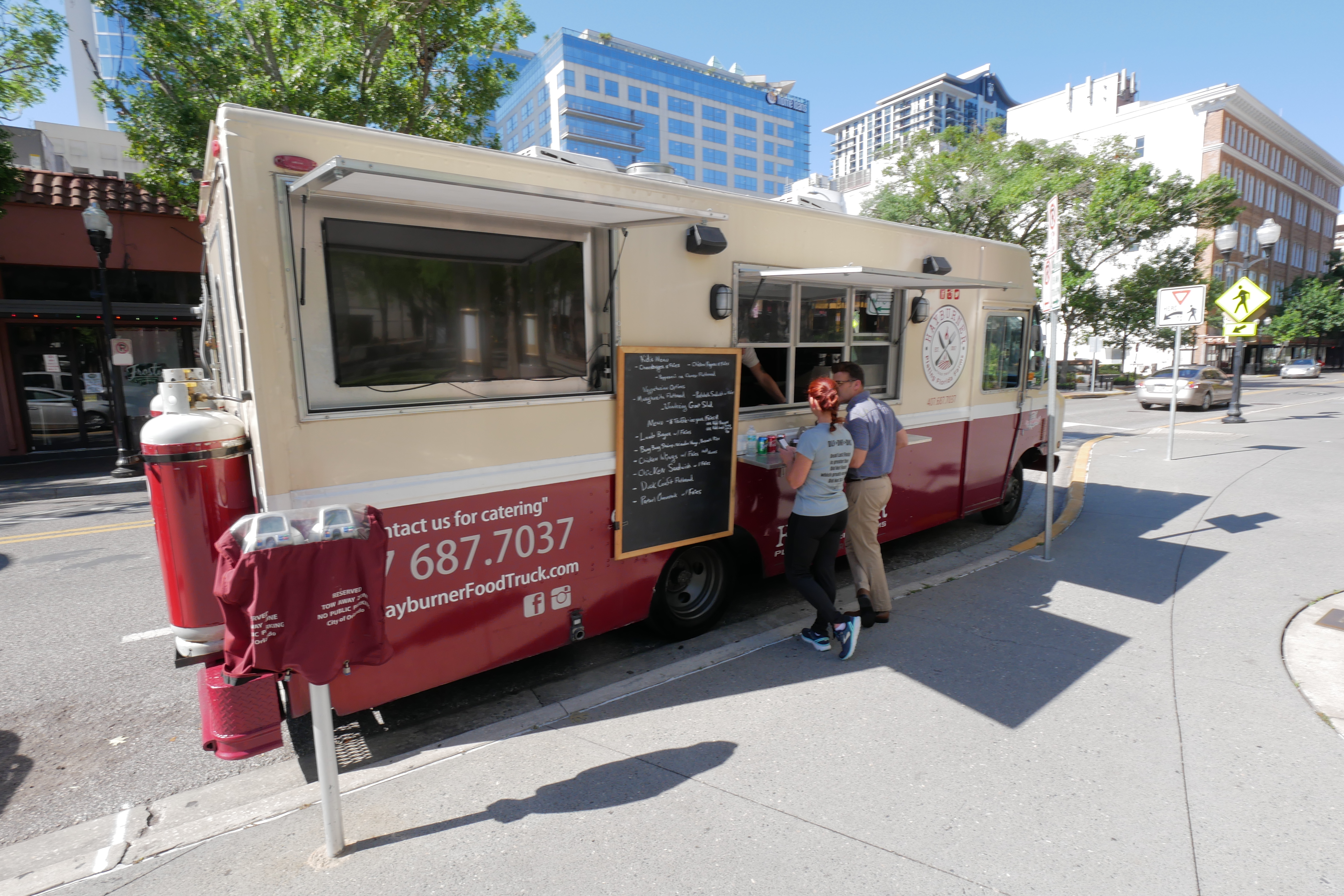 people ordering from food truck