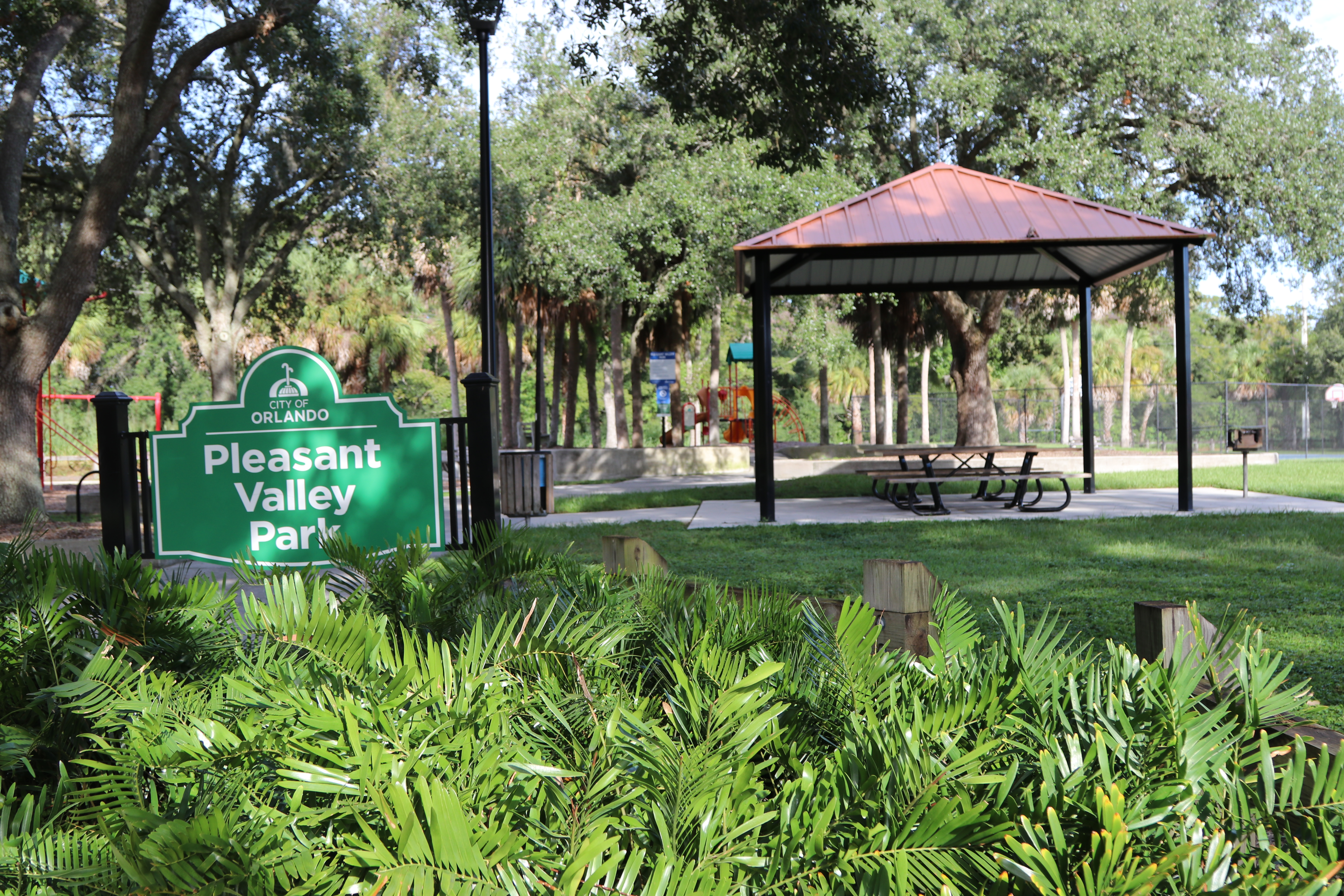 Pleasant Valley Park sign with pavilion behind