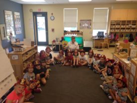 OFD firefighter reads to children