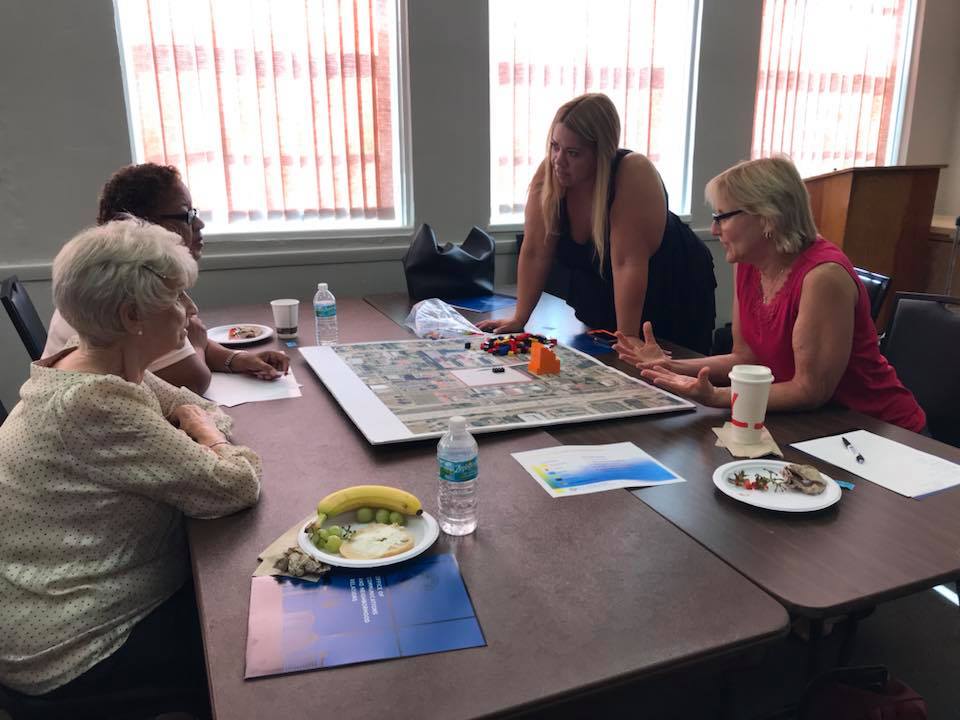 Four neighborhood leaders discussing community improvements