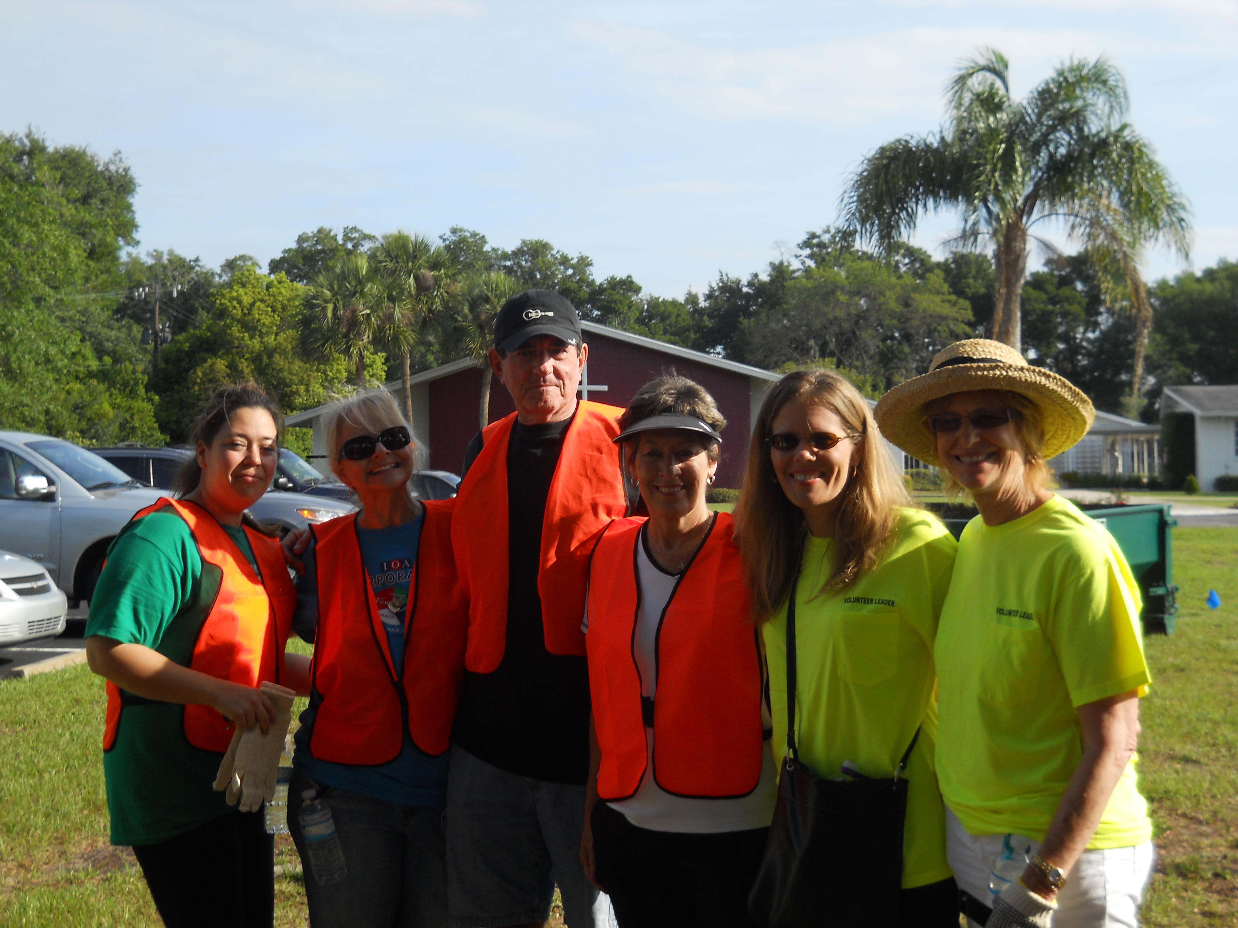 A group of volunteers standing together smiling